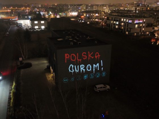 Laser Graffiti Alpha Vision – branding eventowy na budynku nocą