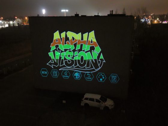 Laser Graffiti Alpha Vision – logo rysowane laserem na budynku